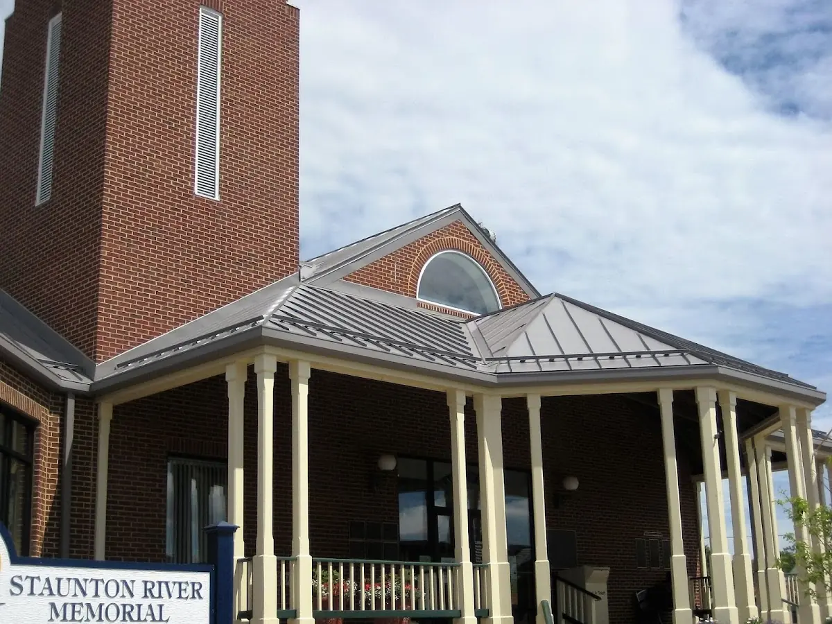 Skilled roofing craftsmen working on a residential roof in North College Park